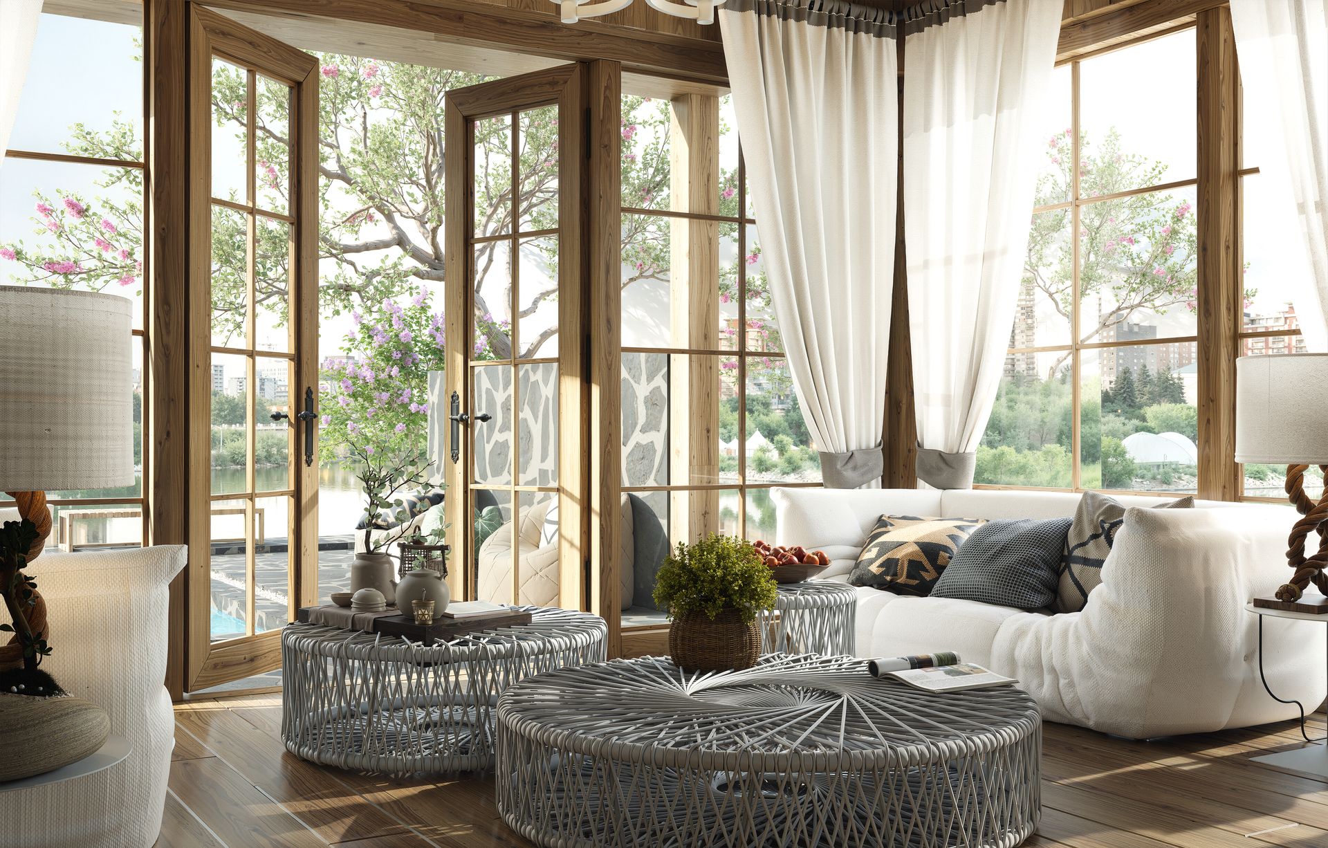 An image of an open modern living room, with light curtains, couch, and coffee table.