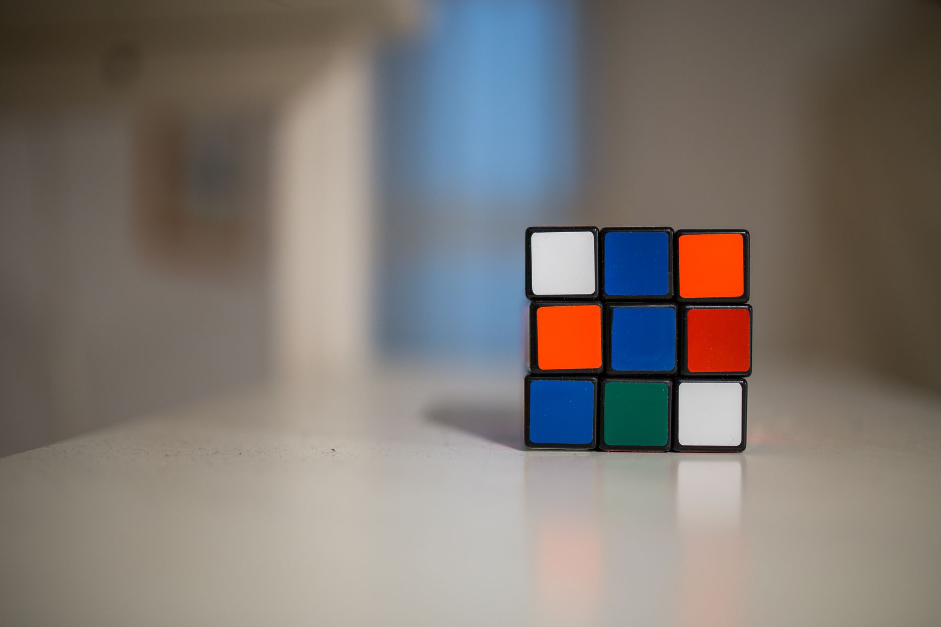 An image of a cube puzzle on a countertop.