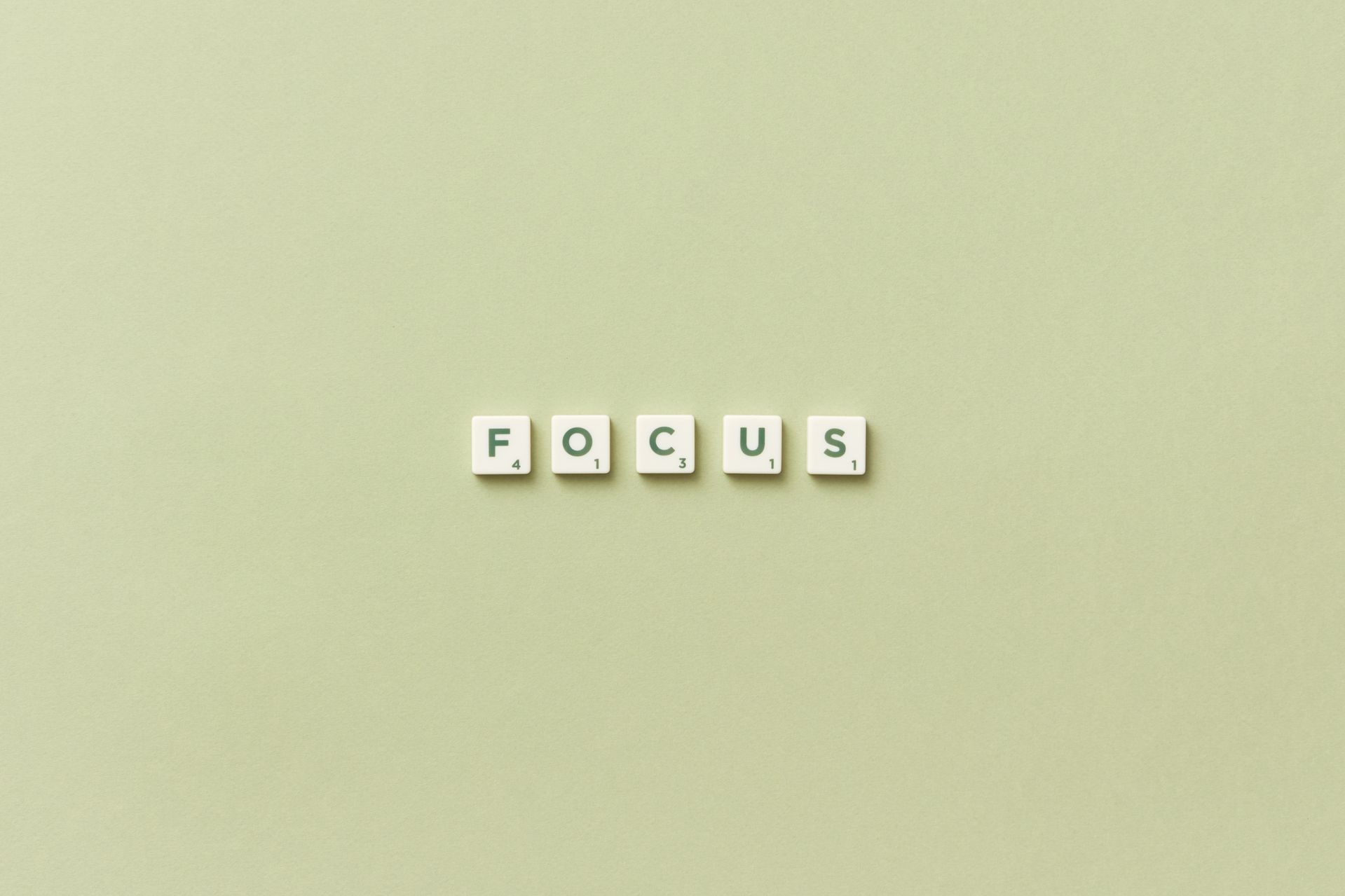 An image of tiles spelling "Focus" on a green background.