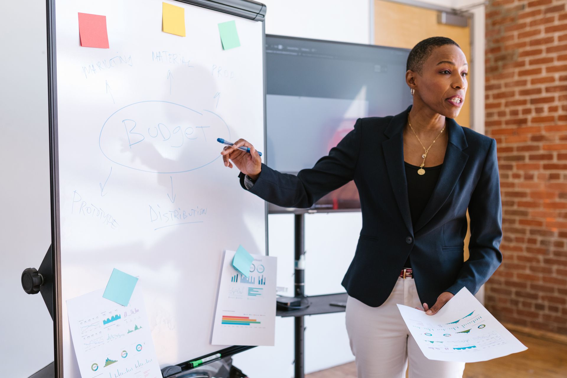 An image of a businesswoman giving a presentation.
